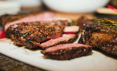 autumn bbq catering steak on a chopping board.